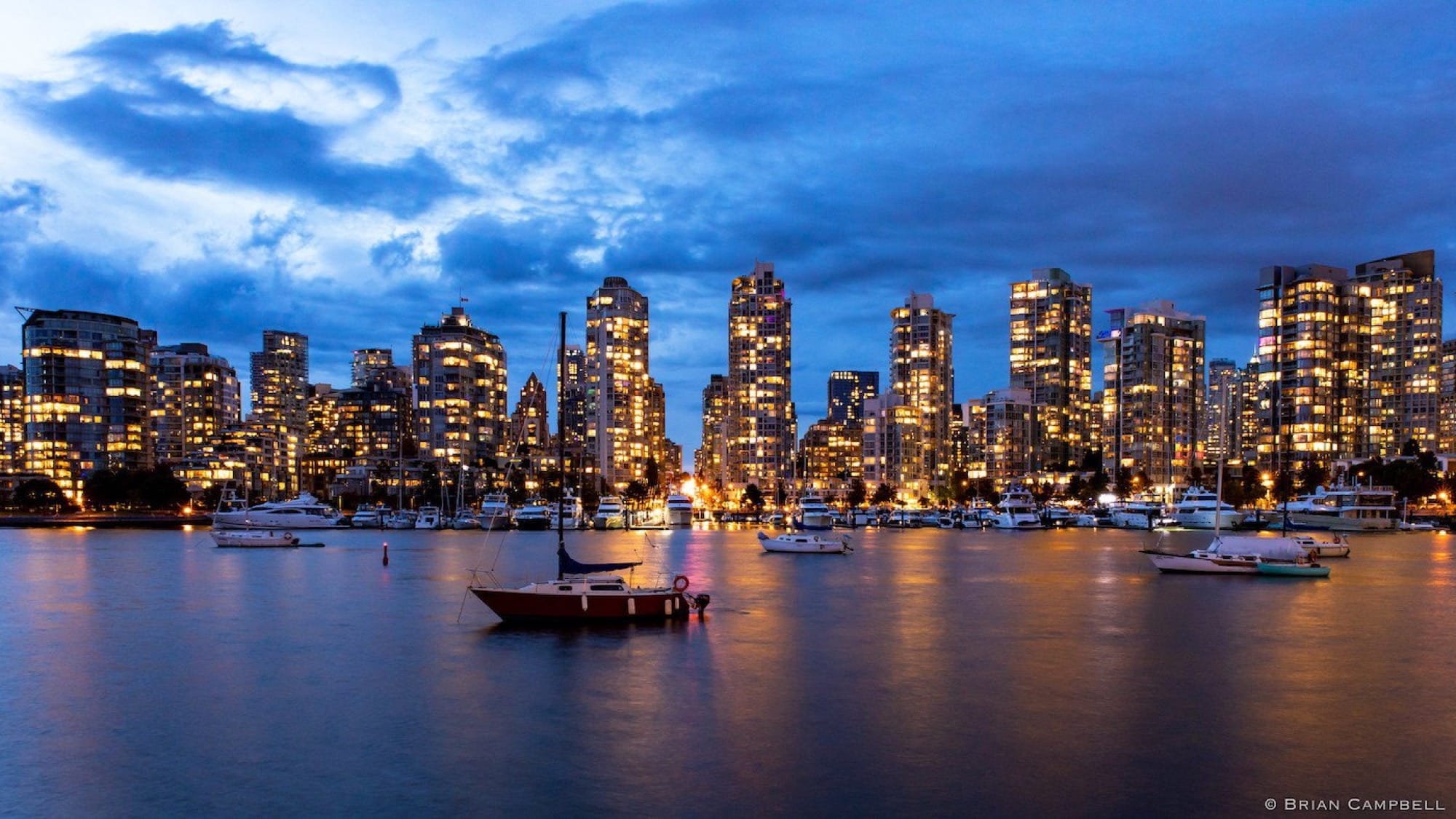 Vancouver skyline in the evening, boats in the foreground